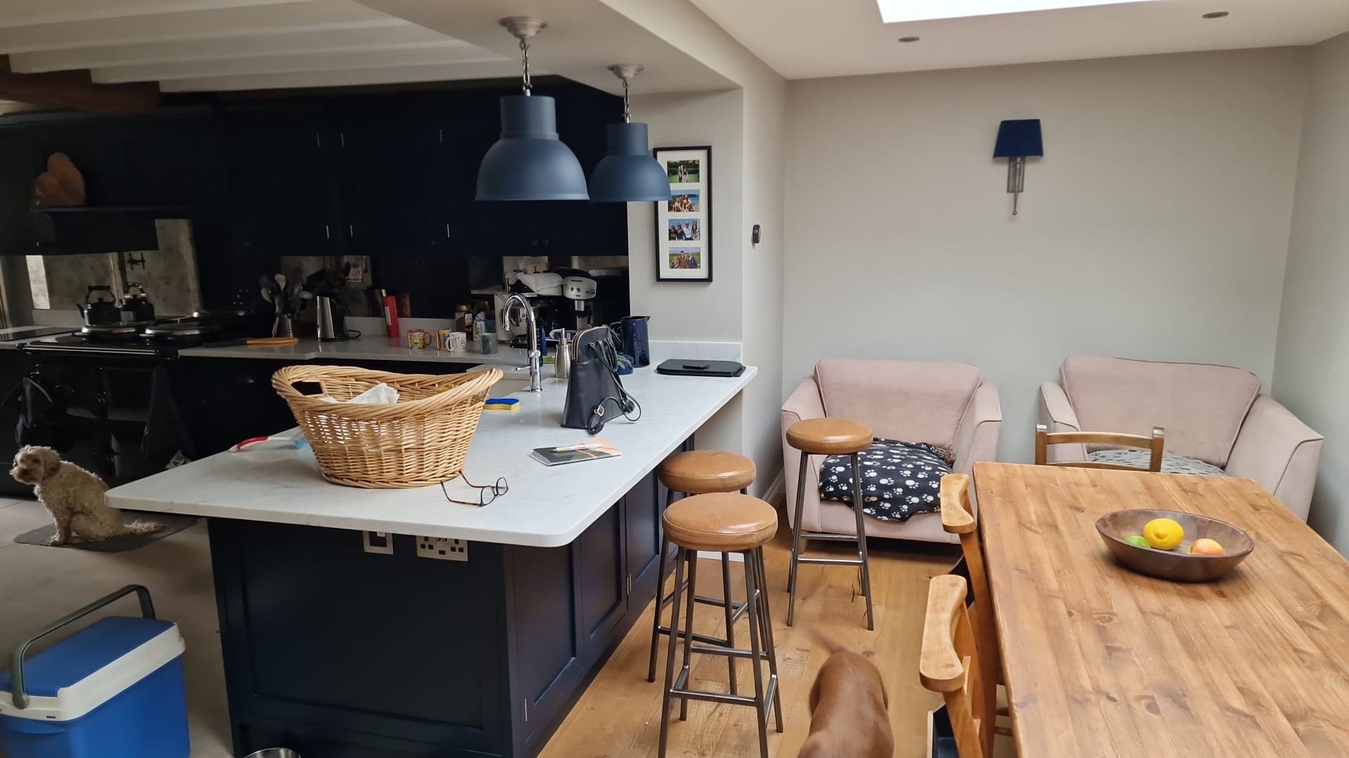 Kitchen island beside a dining table and seating area, from Alpha Renovations Ltd's gallery