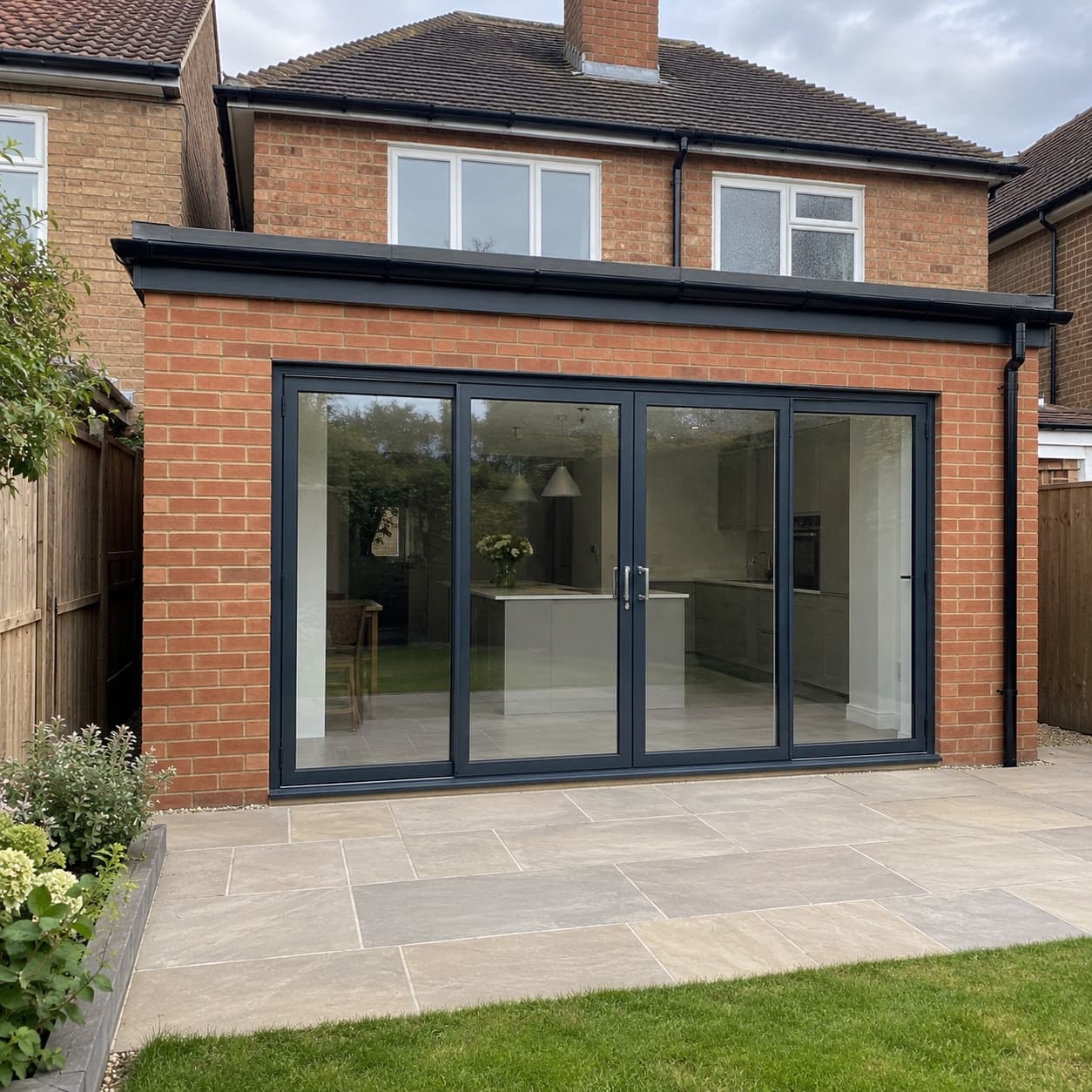 A finished single-storey rear extension with glazed doors onto a patio